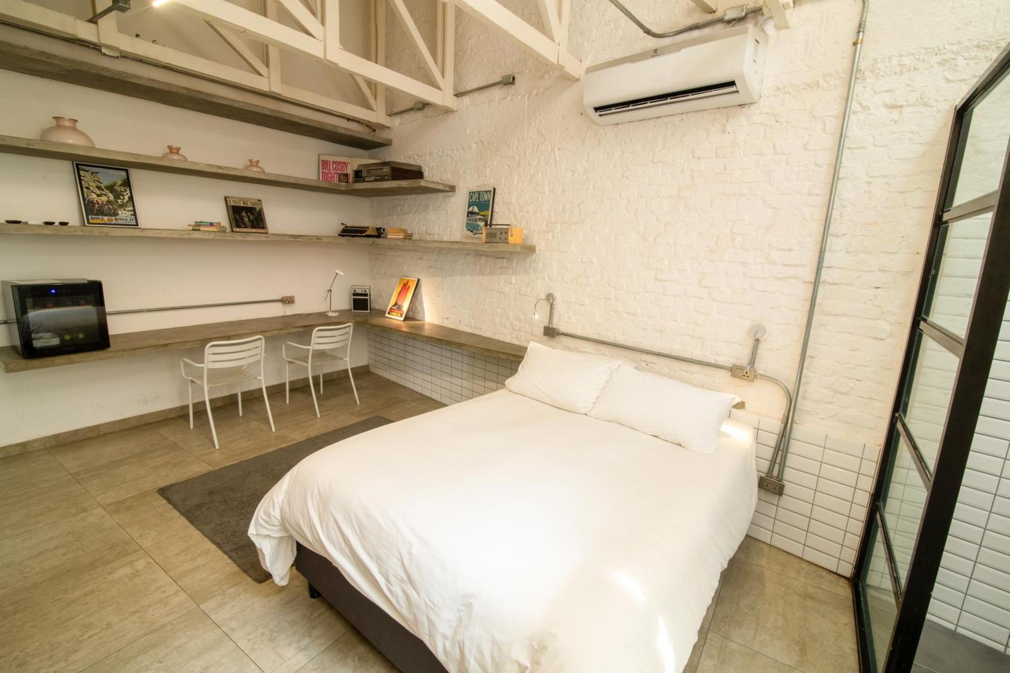 Cosmopolitano Hotel Boutique Santa Cruz de La Sierra Eksteriør billede A bedroom in a micro apartment